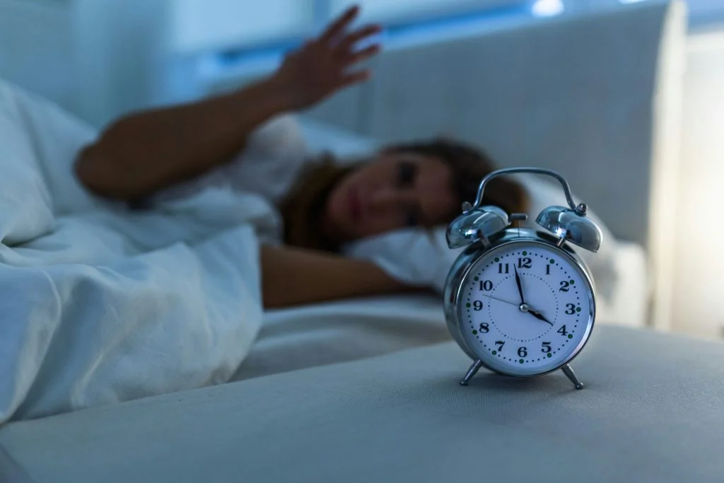 A woman who has woken up from sleeping