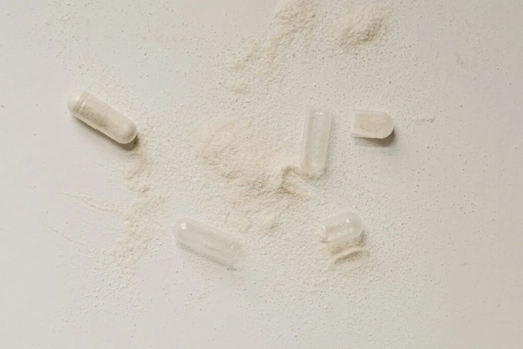 a group of pills with powder on the table