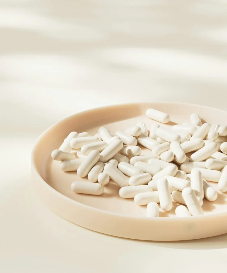 a plate full of white capsules