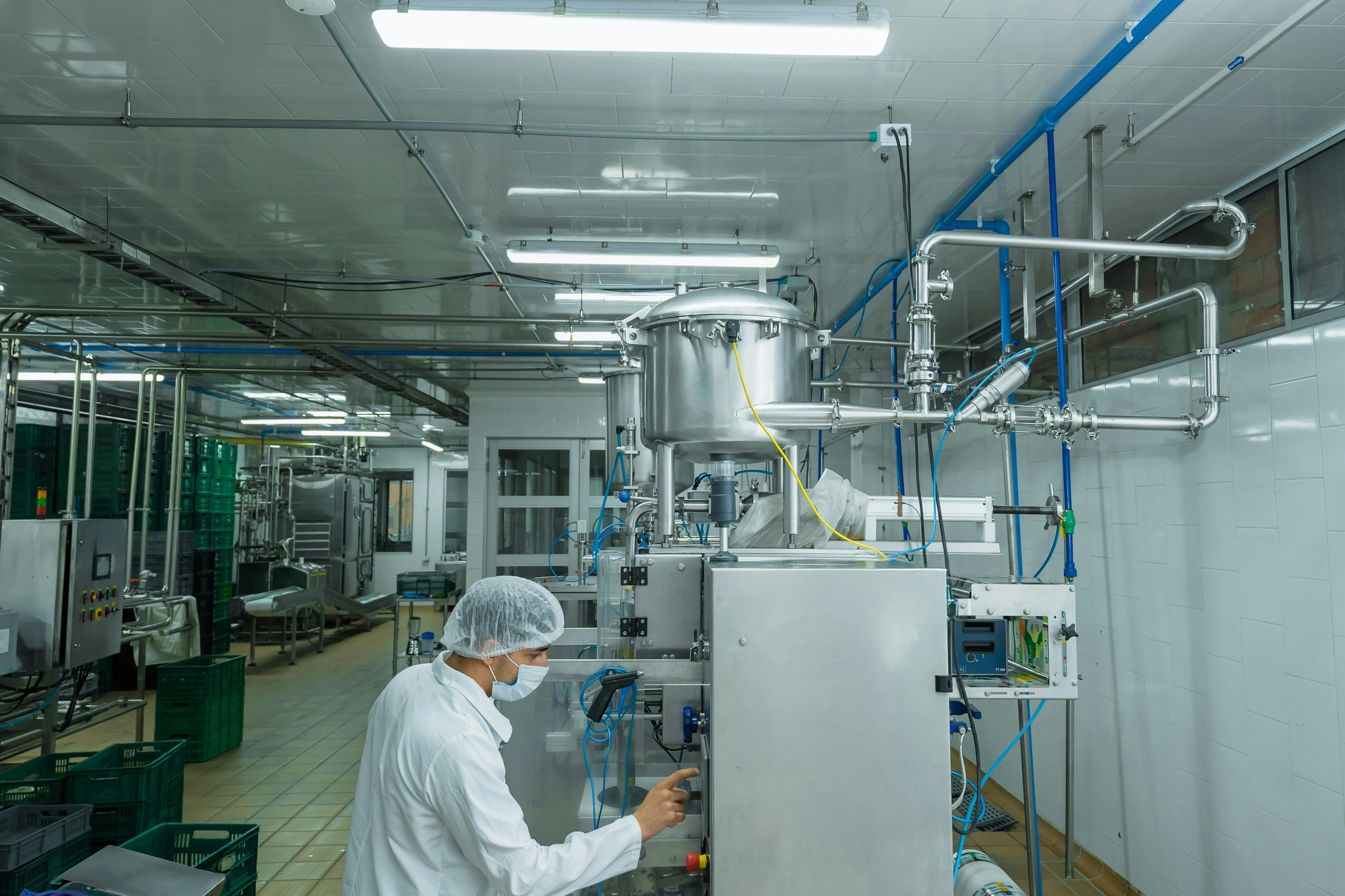 worker in a clean room operating machinery