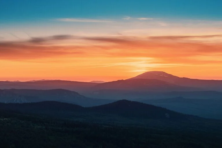 picture of sunset with orange and blue sky with low light