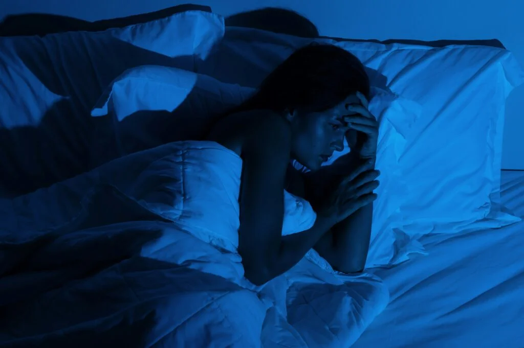 Picture of a woman struggling to sleep