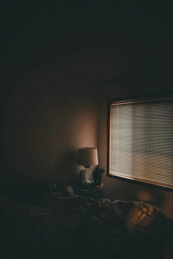 A calm low light bedside evening scene