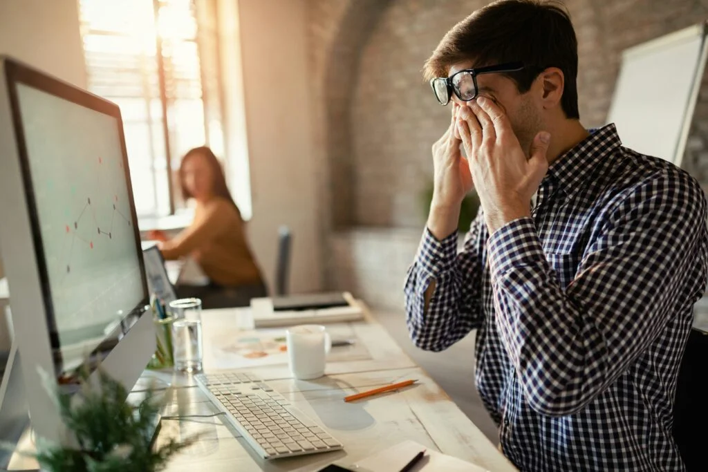 A man exhausted at the office