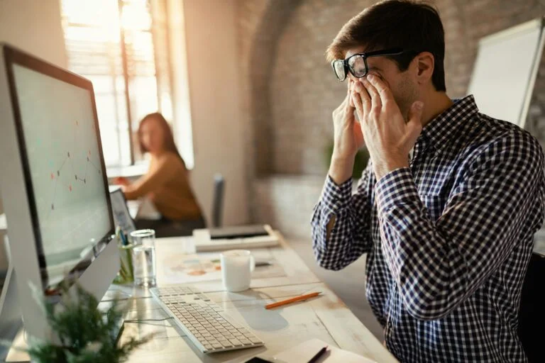 A man exhausted at the office