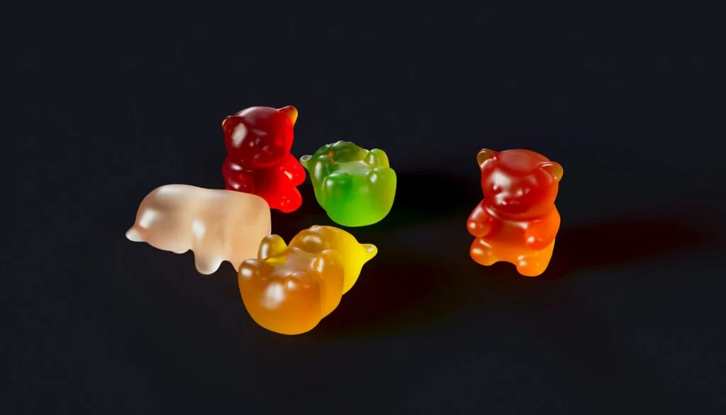 Colourful gummies on a dark background
