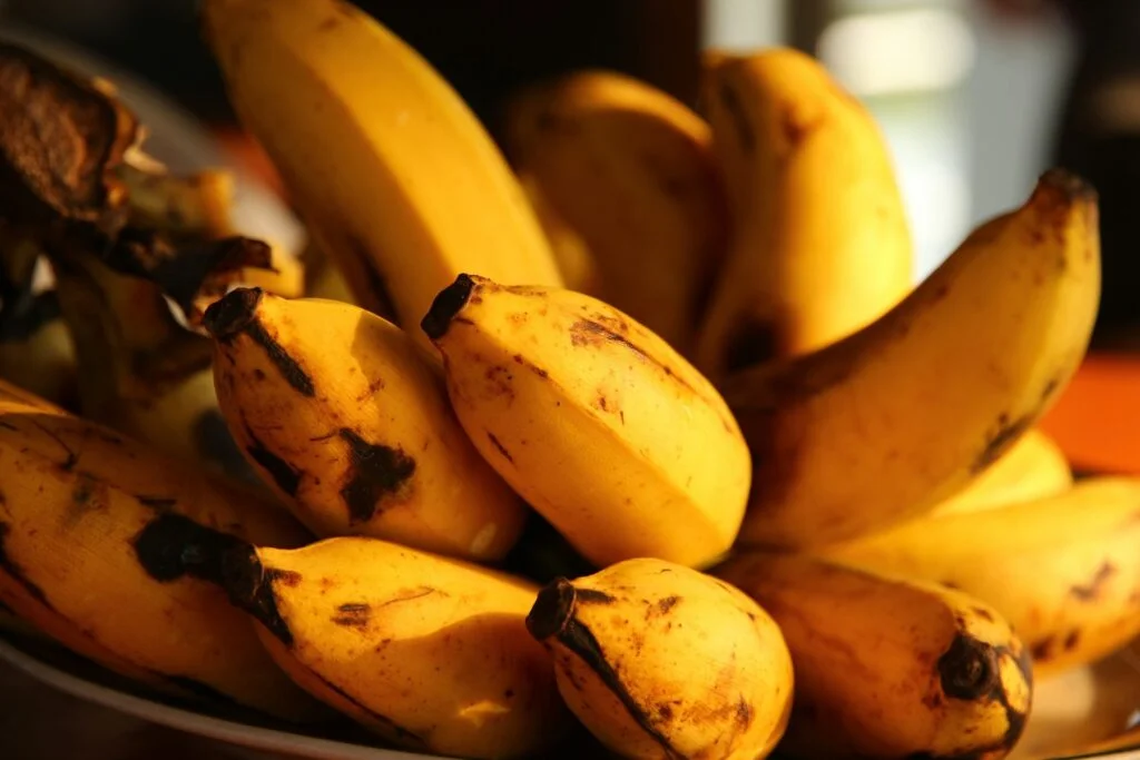 A bunch of ripe bananas in warm evening light