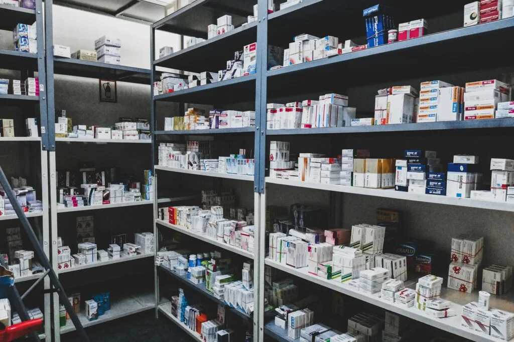Pharmacy shelves stocked with health products