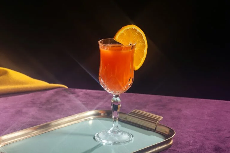 Orange drink in a glass with an orange slice