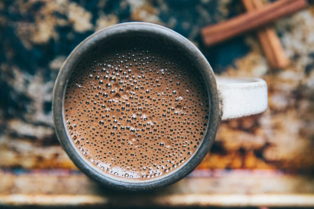 A mug of frothy malted milk drink from above
