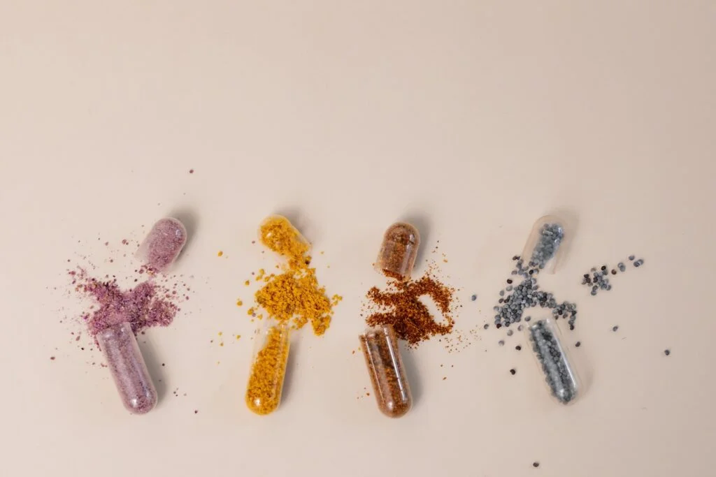 Open supplement capsules with different mineral powders