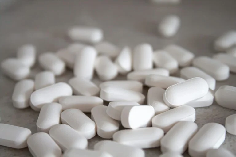 White mineral supplement tablets on a table