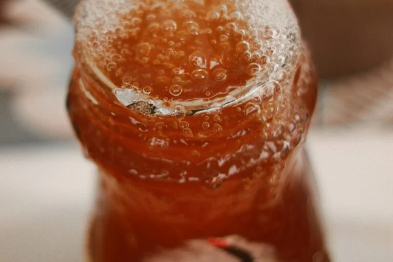 A fizzing amber drink with bubbles