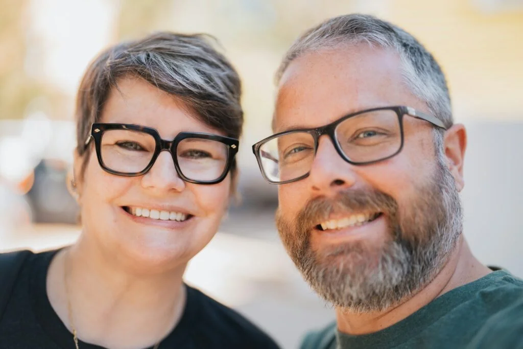 Smiling middle-aged couple together outdoors, supporting each other through perimenopause