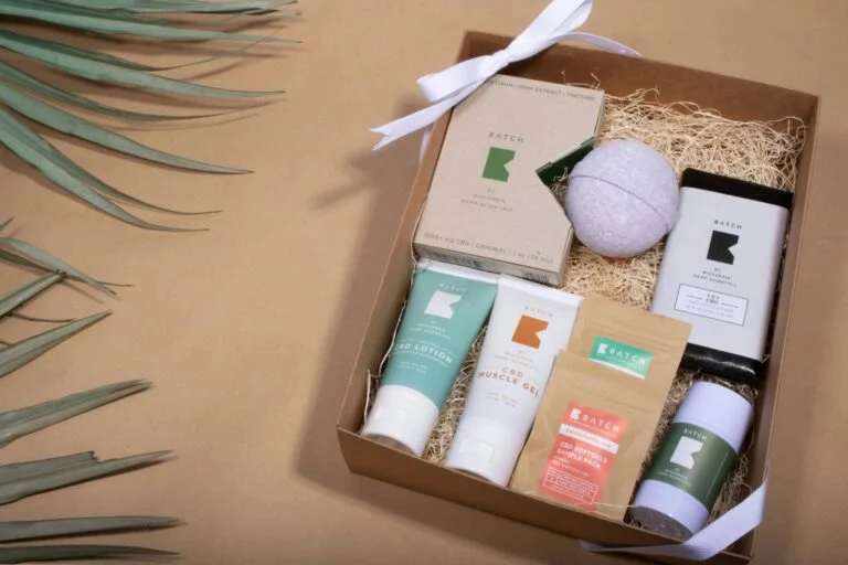 A self-care gift box with skincare, bath and tea items