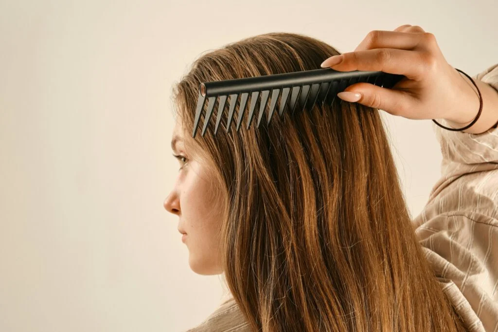 A woman combing her long hair