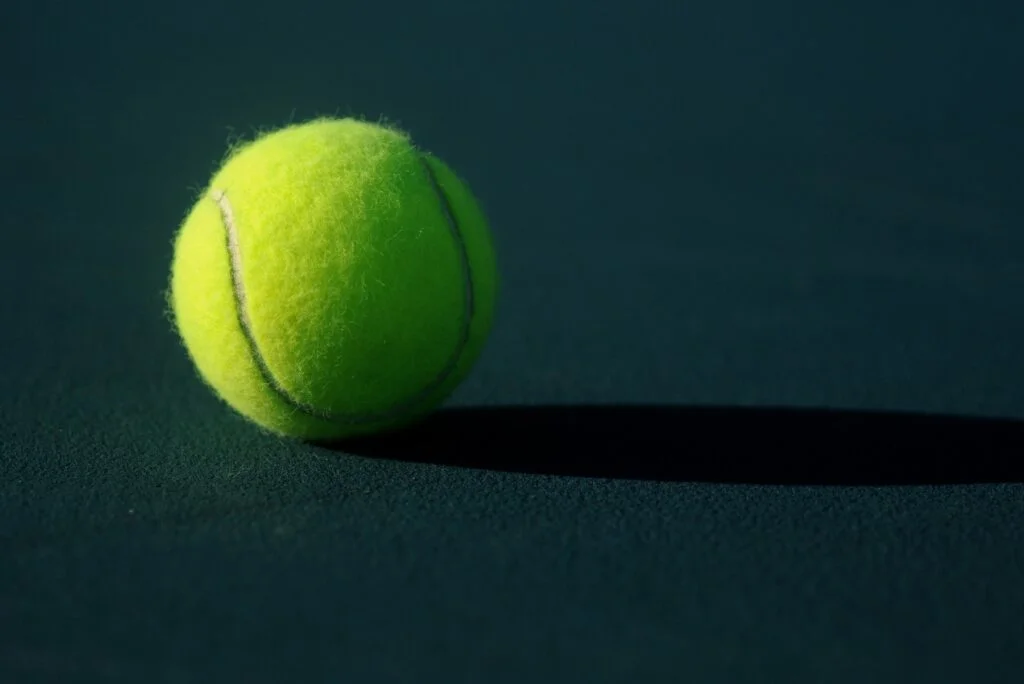 A tennis ball on a court