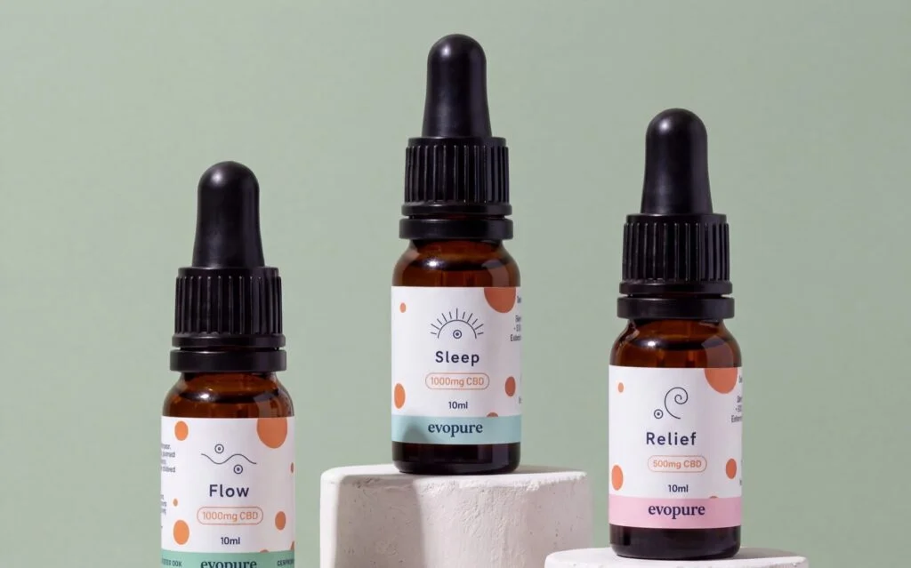 Evopure Flow, Sleep and Relief CBD oils on stone plinths
