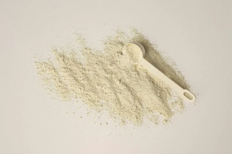 Pale herbal powder with a measuring scoop