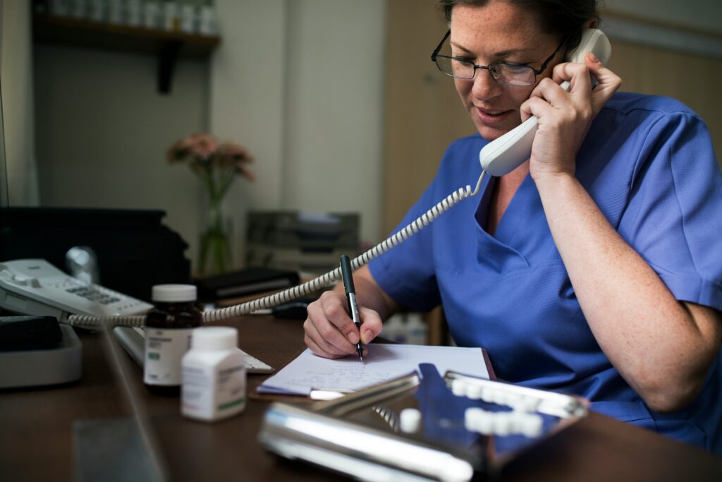 A woman on the phone taking notes