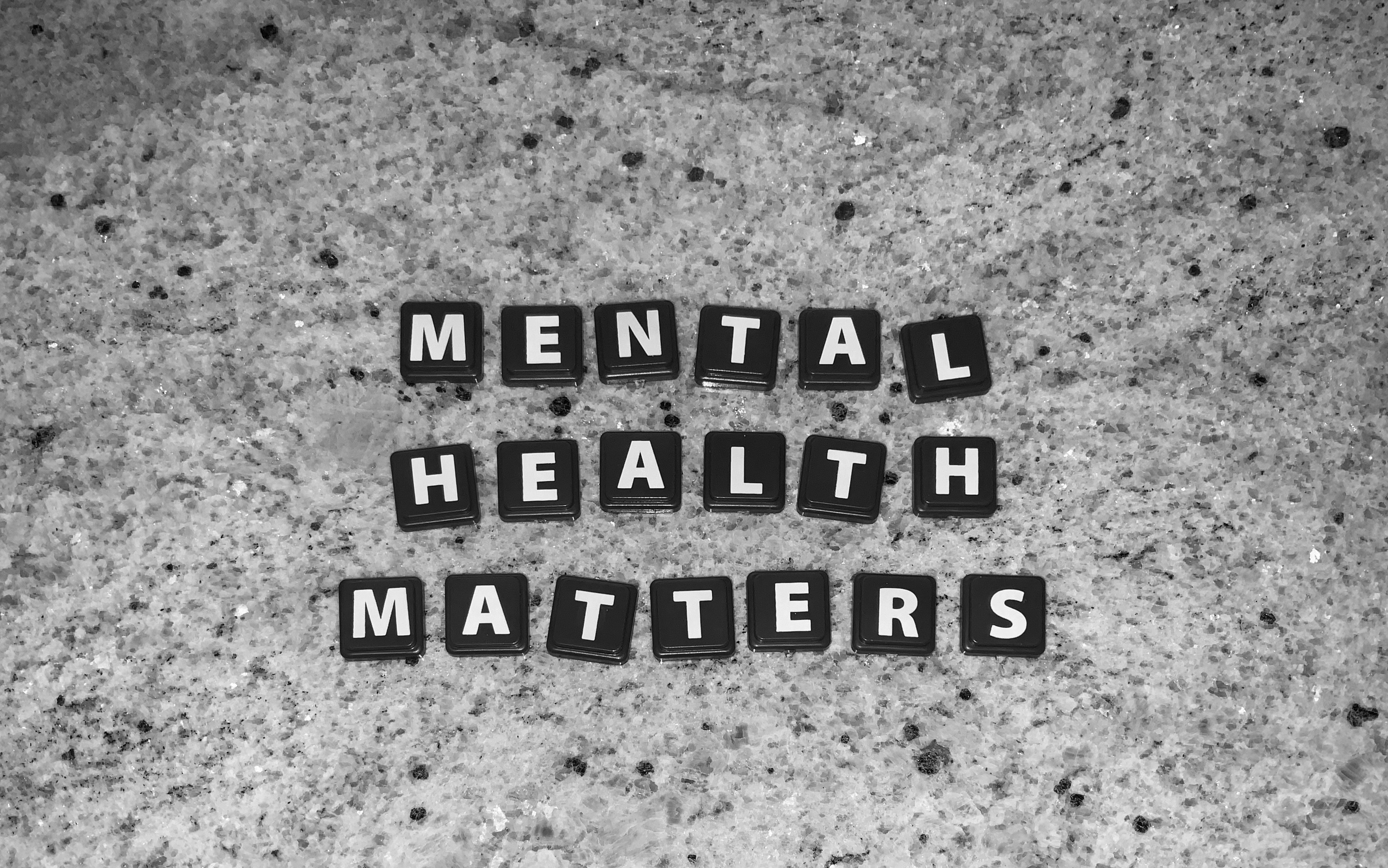 Black letter tiles spelling mental health matters