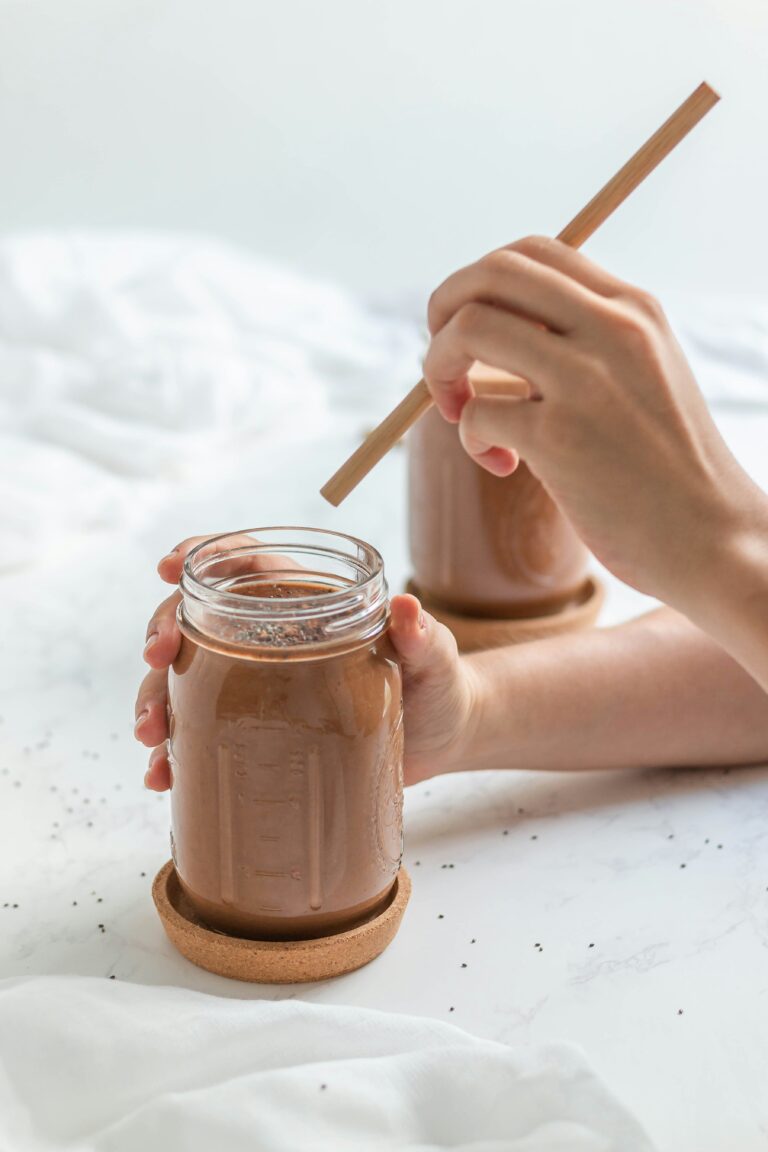 a person holding a reishi mushroom drink