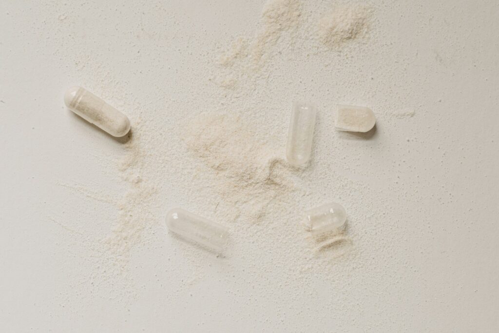 a group of pills with powder on the table