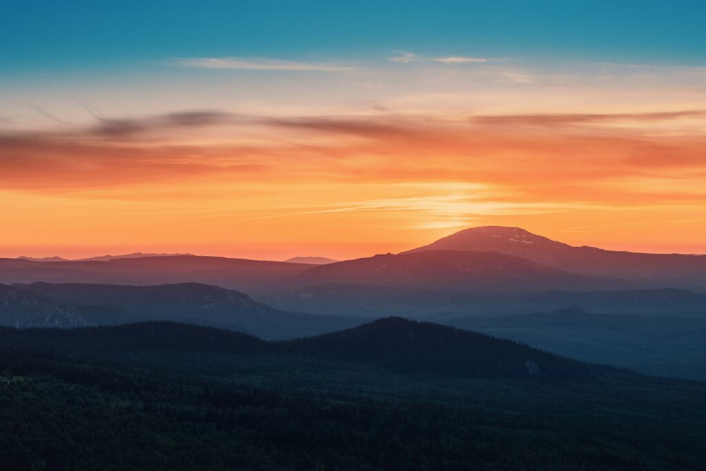 picture of sunset with orange and blue sky with low light