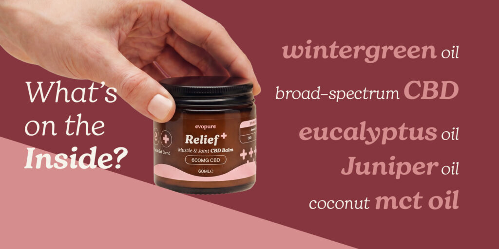 Hand holding a jar of 'Relief+' product with text about oils on a red landscape background