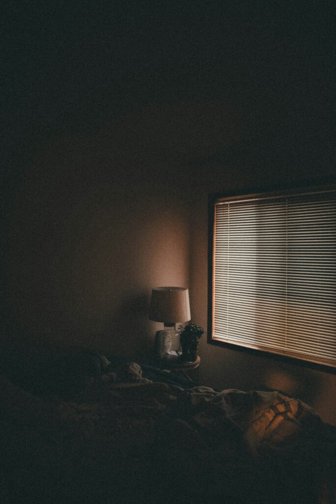 A calm low light bedside evening scene
